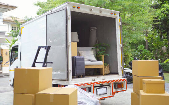istockphoto-1460990606-612x612 Truck car moving house for customers, delivering boxes and furniture. Vehicle transportation. Shipping and packaging business occupation service company. People lifestyle.